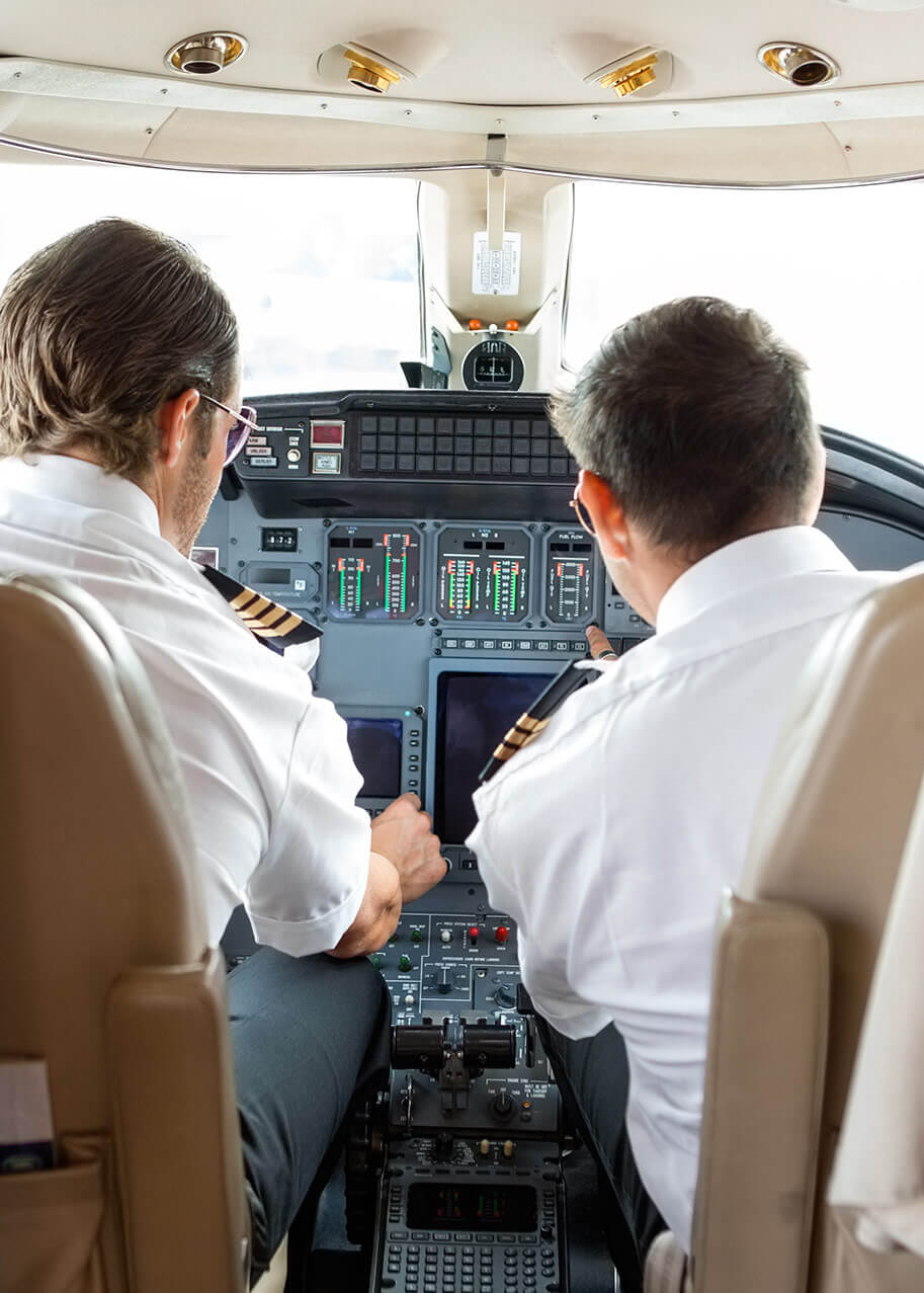 pilots-operating-controls-of-private-jet-PGYFCS2-1